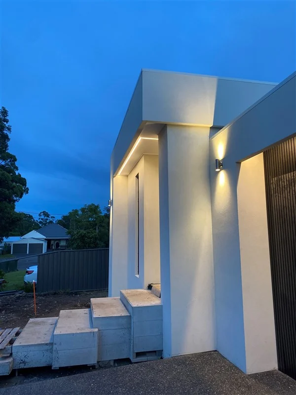 Outdoor lighting on a home exterior at night